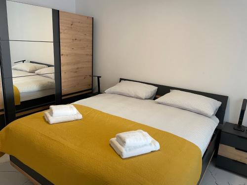 a bedroom with two beds with towels on them at Villa Anna's heaven in Imotski