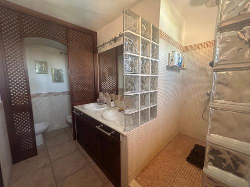 a bathroom with a sink and a toilet at A pie de playa con vistas al mar in Zahara de los Atunes