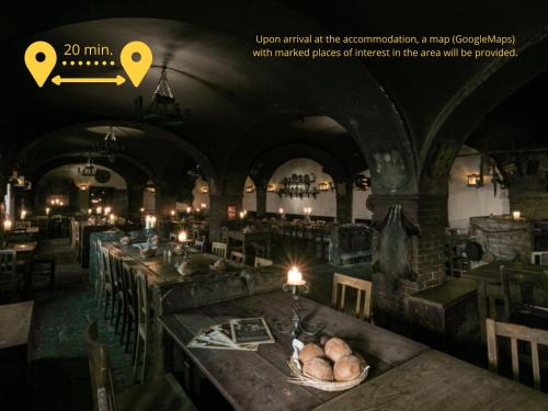 a room with a long table with candles in it at Valdštejn - pohoda v Českém ráji in Jičín