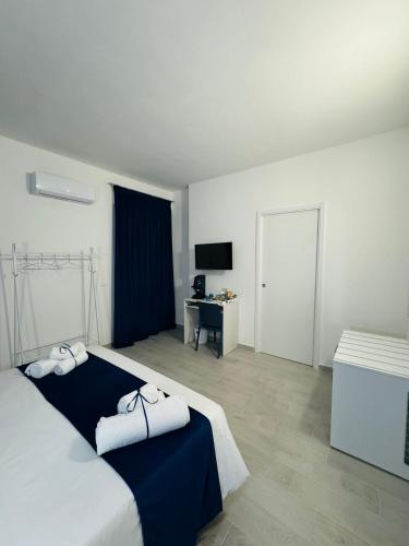 Postel nebo postele na pokoji v ubytování Sirio rooms and apartments