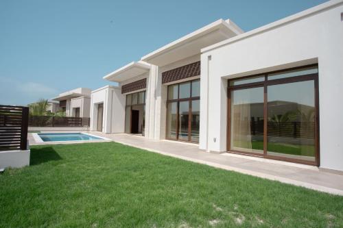 a rendering of a house with a yard at The Hawana Pearl لؤلؤة هوانا in Salalah