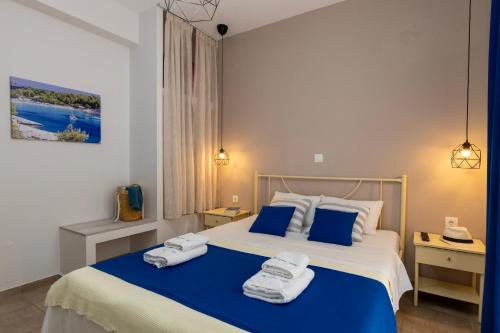 a bedroom with a bed with towels on it at Antigone View Apartments in Skala Potamias