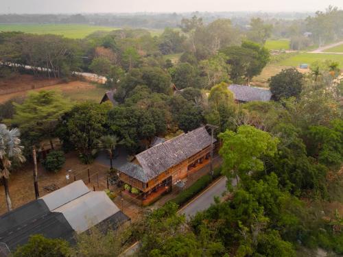 an overhead view of a house in a forest at Ban MaeBo Local Stay in Ban Nong Han