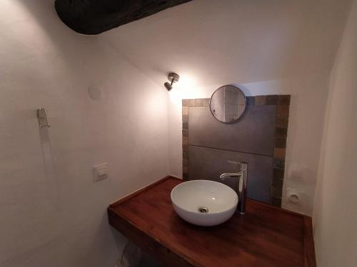 a bathroom with a white sink and a mirror at Sole e Ventu in Velone-Orneto