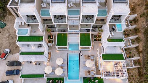 an aerial view of a building with a pool at ZEST THASSOS LUXURY RETREAT in Limenaria