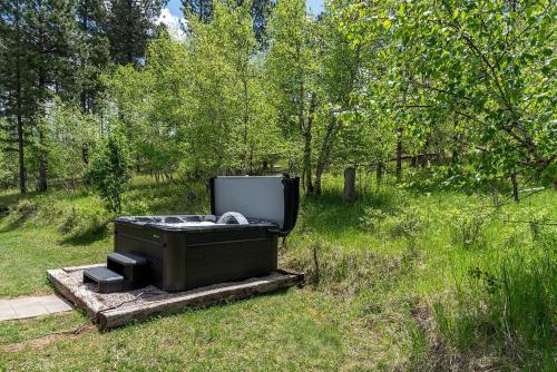 a tv sitting in the grass in a field at Peaceful Valley Hideaway in Rapid City