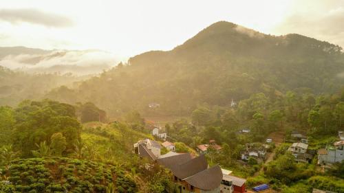 a small town in a valley with a mountain at O2 Villas Ella in Ella