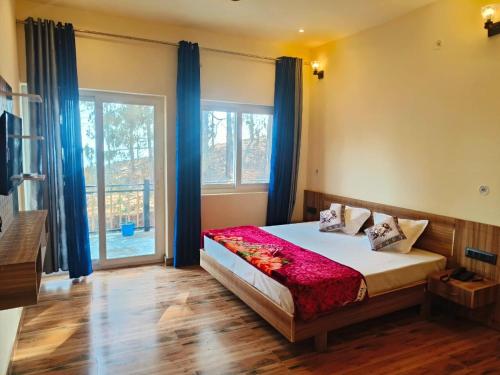 a bedroom with a bed and a large window at Monarch Hills in Lansdowne