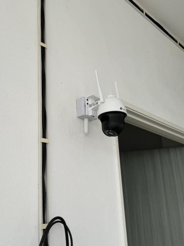 a security camera on the side of a building at Acik Homestay in Pokok Sena