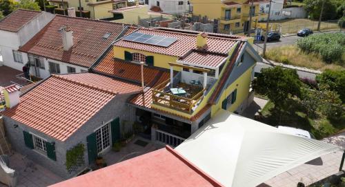 an overhead view of a house with a roof at Sun house - Near Sintra - Kitchen - Pool in Sintra