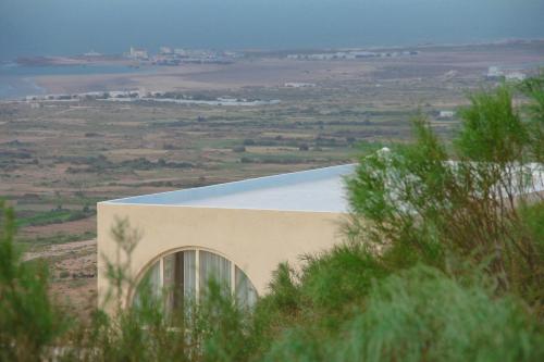 a building in the middle of a field at ALNA mogador in Akermoud