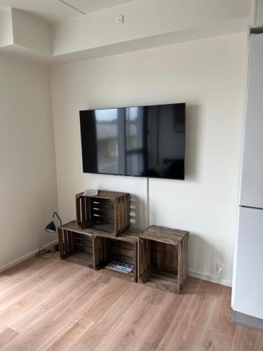 a living room with a flat screen tv on a wall at Casa House of bricks 3 - LEGO HOUSE 300 meters - Town center 200 meters in Billund