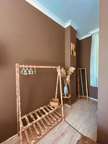 a room with a bed frame in a room at WoodSea in Batumi