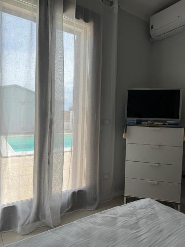 TV o dispositivi per l'intrattenimento presso VILLA AQUA LUXURY Private Pool