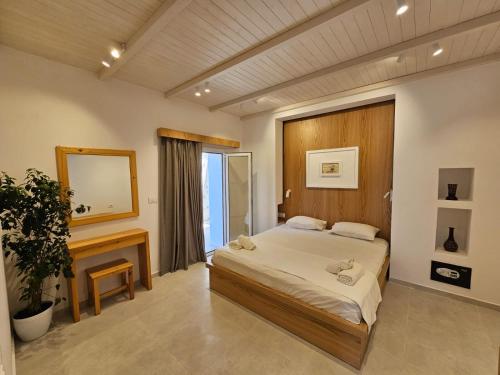 Cama o camas de una habitación en Argileos