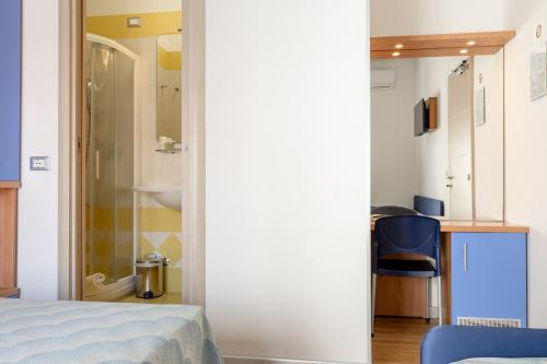 Кровать или кровати в номере Hotel Riviera