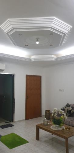a living room with a couch and a coffee table at HOUSE IN AL AIN - 4 in Al Ain