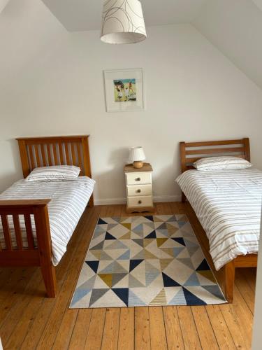 Postel nebo postele na pokoji v ubytování Ploumilliau House