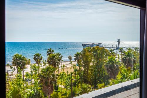 a view of the beach and the ocean from a building at Marina Luxury Suites by PS in Durrës