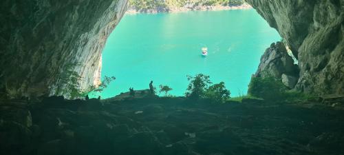 a view of a body of water from a cave at Delicious in Pluzine