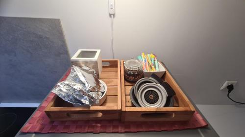 a wooden box filled with items on a table at Parenthèse Bien-Être in Le Pouzin