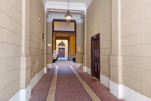 an empty hallway of a building with doors and a hallwayngth at Domus Aurea Luxury Suites in Rome