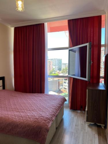 Ένα ή περισσότερα κρεβάτια σε δωμάτιο στο от Зуры