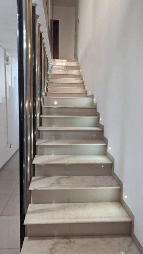 a stairway in a building with a bunch of stairs at Villa Victoria Résidence in Lomé