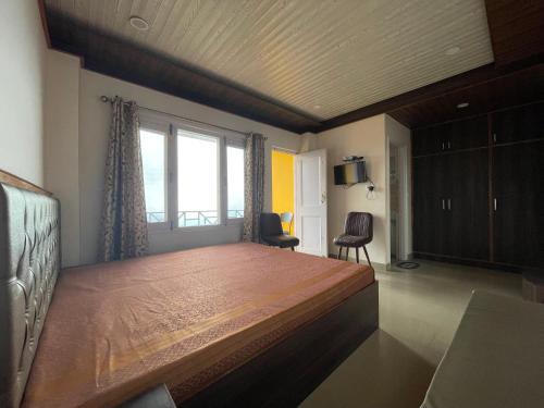 Postel nebo postele na pokoji v ubytování Hotel Jeevan Jyoti