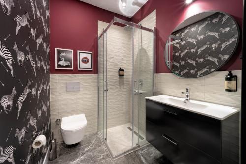 a bathroom with a shower and a sink and a toilet at Siesta Hotel Bakırköy in Istanbul