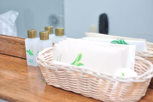a basket of toiletries sitting on a counter at Hotel Laureles 70 Medellín in Medellín