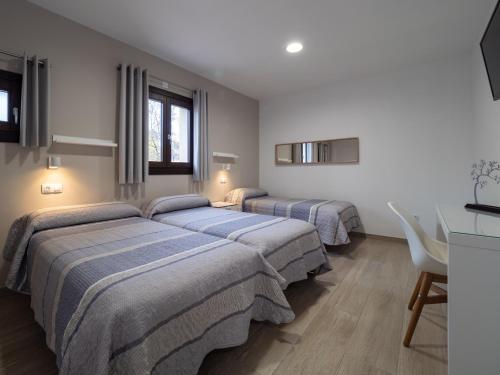 Ένα ή περισσότερα κρεβάτια σε δωμάτιο στο Casa Forestal