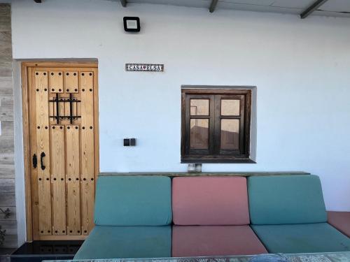 a room with a couch and a window and a door at Casa Elsa Ceuta in Ceuta