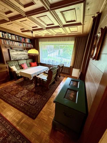 a living room with a couch and a table at Ferienhaus Moßhammer in Lofer