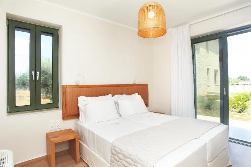 Ένα ή περισσότερα κρεβάτια σε δωμάτιο στο Anagallis Villas
