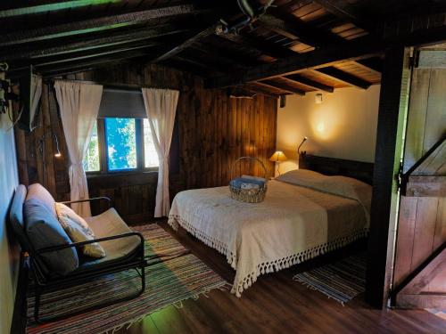 Säng eller sängar i ett rum på O Cantinho de Coura - a cabana