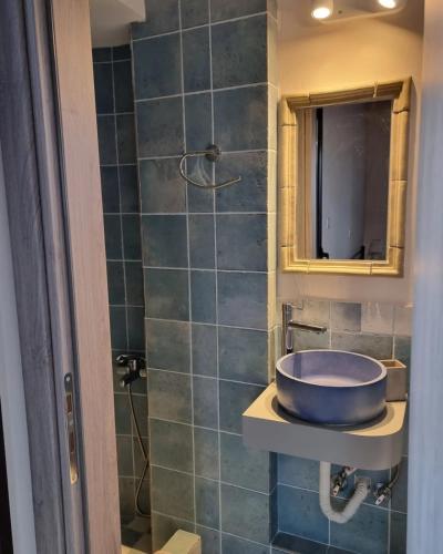 a bathroom with a sink and a shower at Villa Rodi in Galaxidi