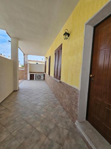 an empty hallway of a house with a door at Residenza il Filo in Orosei