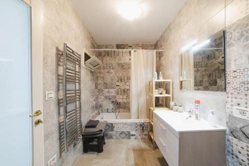 a bathroom with a tub and a sink and a shower at Historical big & quite house in the mid of Salento in Cutrofiano