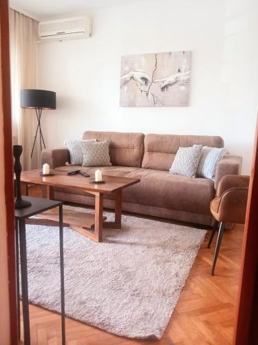 a living room with a couch and a coffee table at DukeStepa in Belgrade