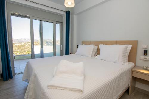 Ένα ή περισσότερα κρεβάτια σε δωμάτιο στο Κatakis Villas