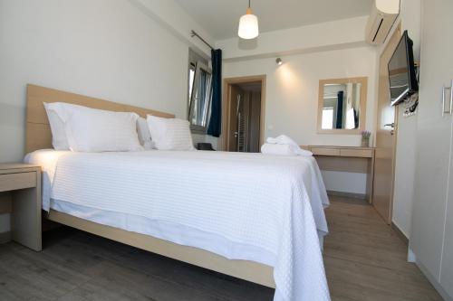 Ένα ή περισσότερα κρεβάτια σε δωμάτιο στο Κatakis Villas