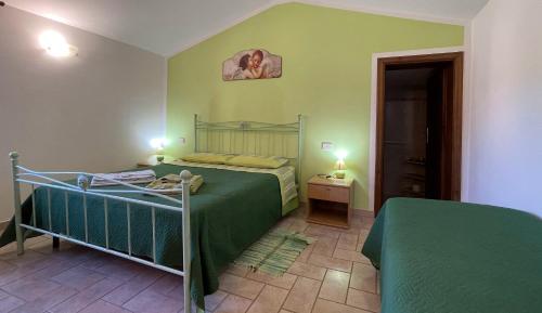 A bed or beds in a room at La Sorgente Del Subasio ASSISI