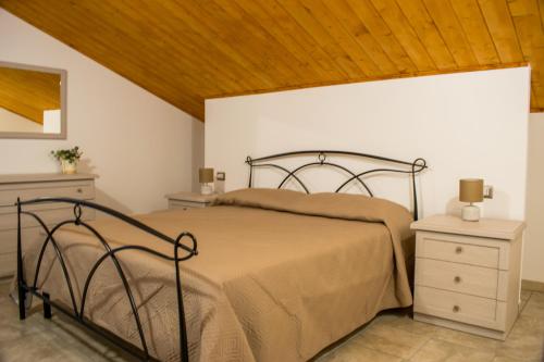 Postel nebo postele na pokoji v ubytování Casa Genisi