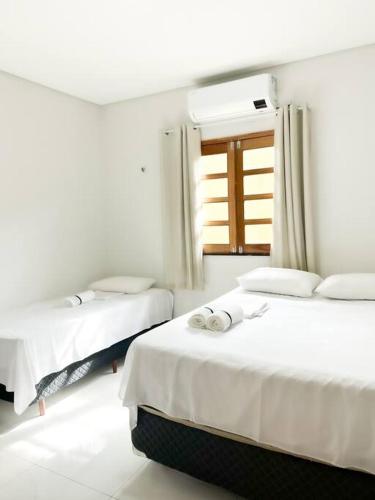 Katil atau katil-katil dalam bilik di Casa na Praia do Preá, com Piscina