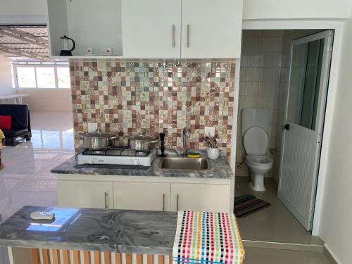 Kuchyň nebo kuchyňský kout v ubytování My Flat 0