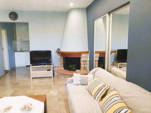 A seating area at VILLA ARHONTIKO