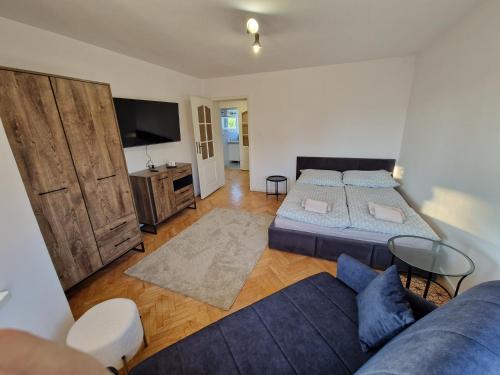 a living room with two beds and a couch at Little Wish in Gdańsk