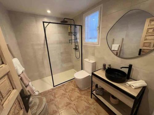 a bathroom with a shower and a toilet and a sink at Spectacular Panorama in Benitachell