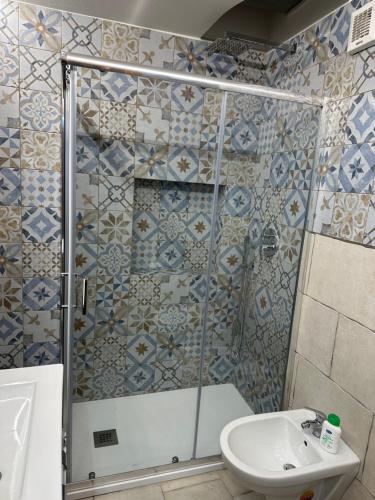 a bathroom with a shower and a sink at Casa di Nonna Rosa in Canosa di Puglia